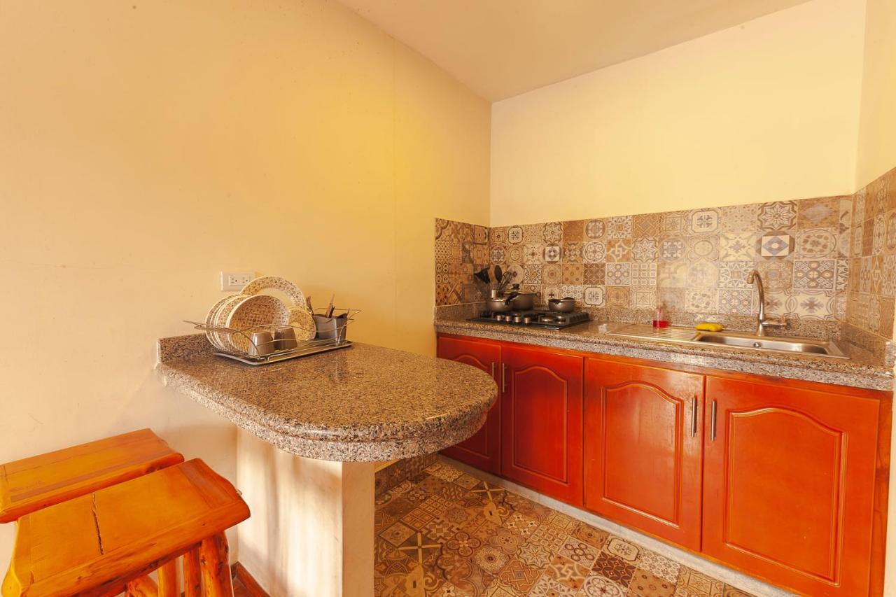 Los Ponchos Inn Apartasuite Otavalo Bagian luar foto